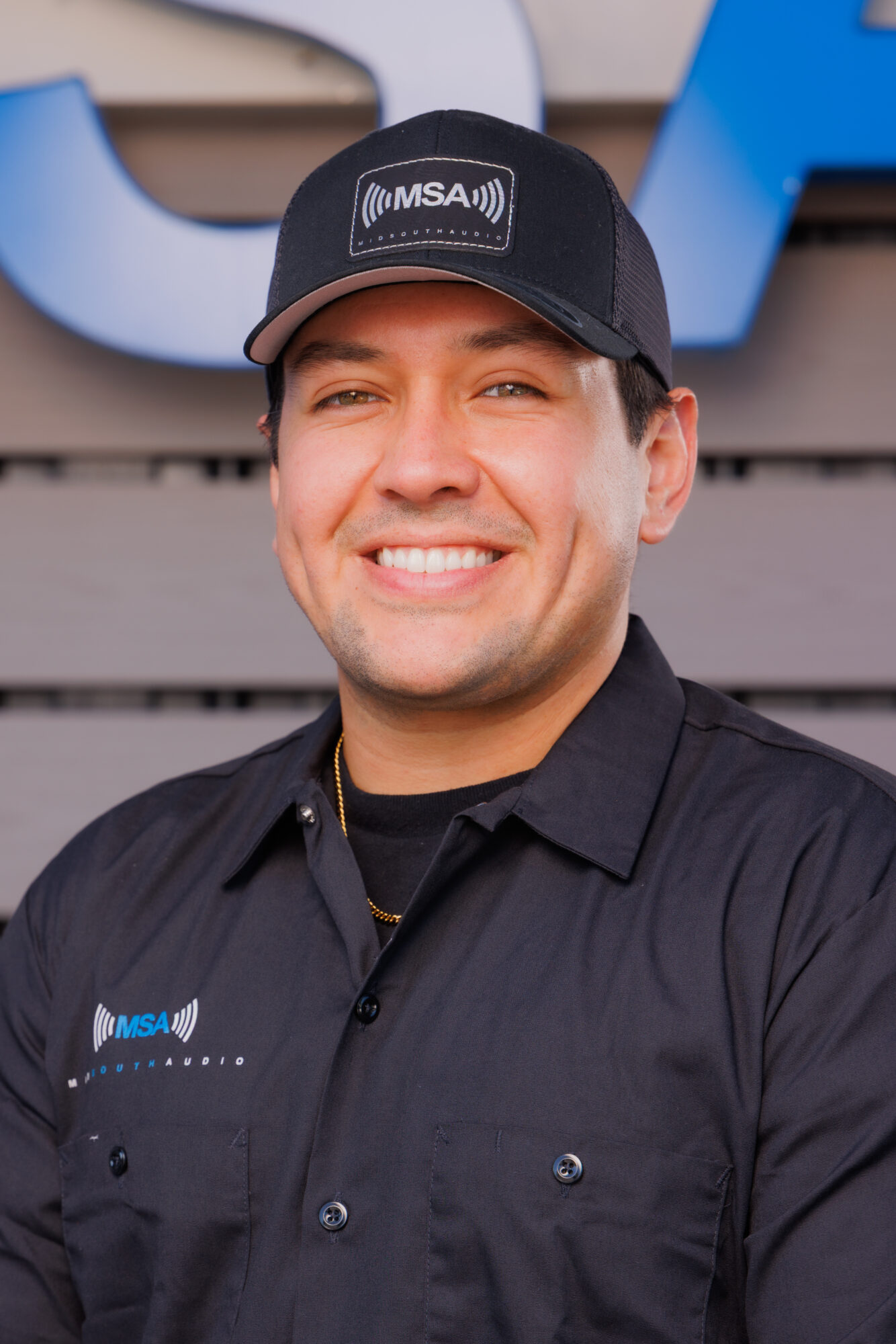 Jesse Rubidoux Smiling man wearing MSA branded baseball cap and shirt